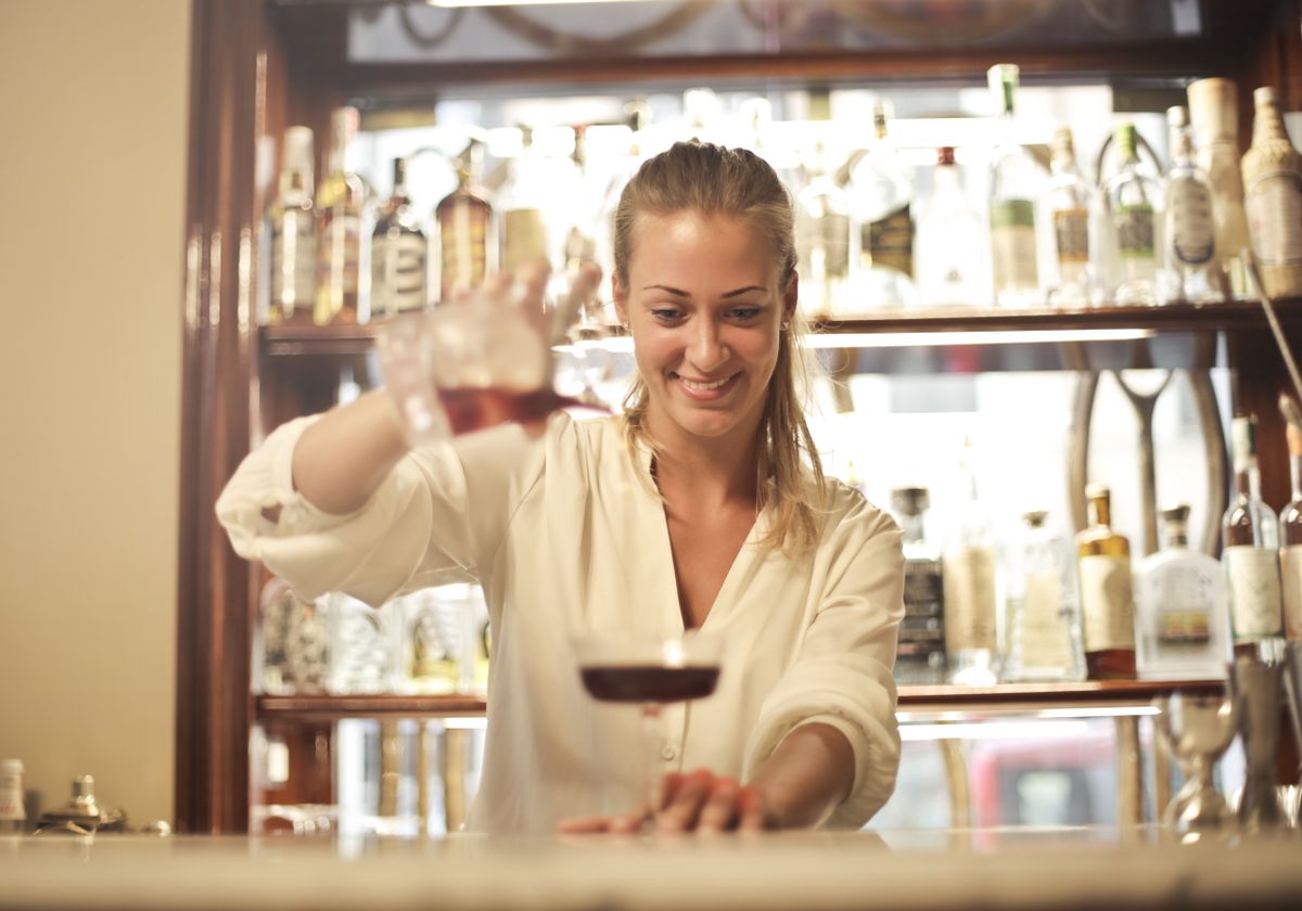 Illustrative portrait of a person behind a bar, used for the live host design persona.