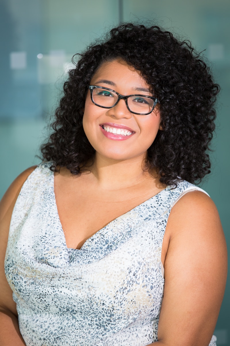 Illustrative portrait of a person wearing glasses, used for the quality-assurance design persona.