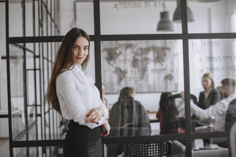 Illustrative portrait of a person in an office, used for the competitive-intelligence design persona.